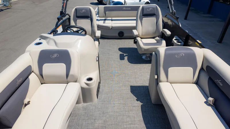 Slide: The Image of 2024 Barletta ARIA 22UC pontoon boat interior with plush seating and modern design. - 12