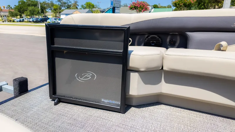 Slide: The Image of 2024 Barletta ARIA 22UC boat interior with beige seating and doggie dock view feature. - 21