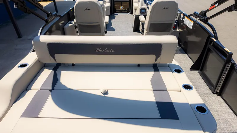 Slide: The Image of 2024 Barletta ARIA 22UC pontoon boat interior with luxurious seating and cup holders. - 9