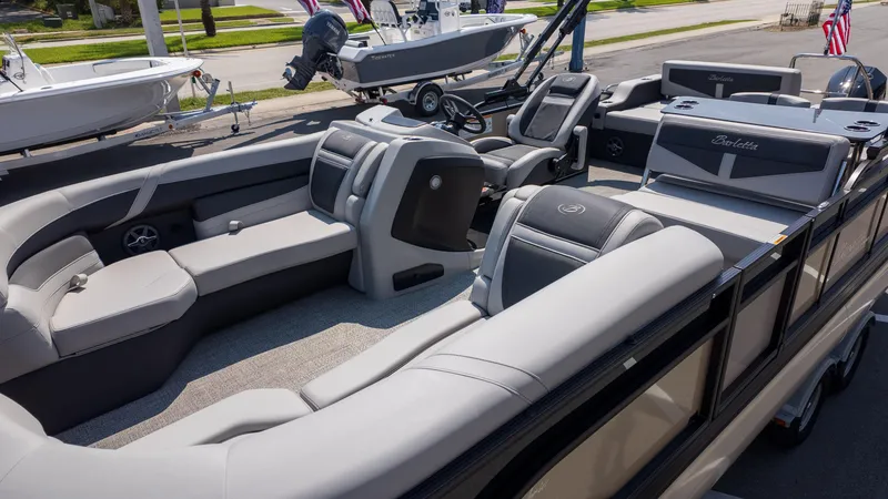 Slide: The Image of 2025 Barletta Cabrio 24UE pontoon boat with luxurious seating and modern design. - 3