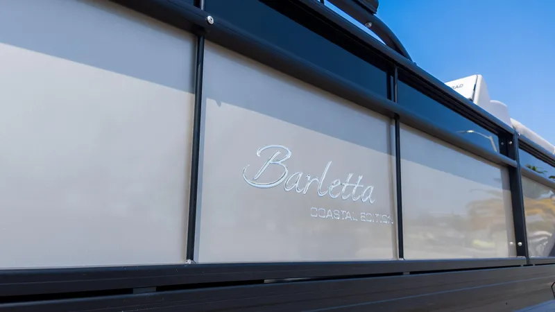 Slide: The Image of 2025 Barletta Cabrio 24UE boat, close-up of side panel with logo. - 6