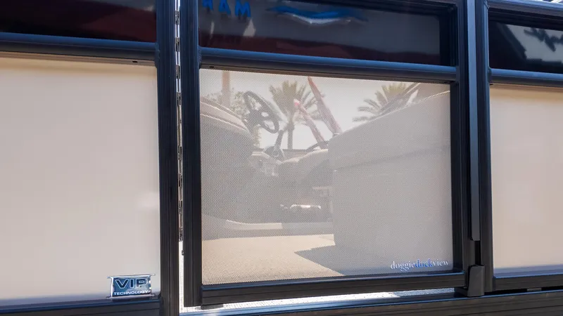 Slide: The Image of 2025 Barletta Cabrio 24UE pontoon boat with VIP technology and doggie dock view feature. - 8