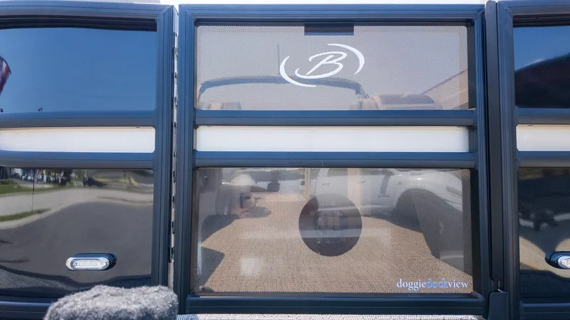 Slide: The Image of 2025 Barletta Cabrio 24UE pontoon boat with sleek design and logo detail. - 9