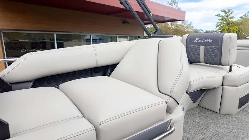 Slide: The Image of 2025 Barletta Lusso 23M pontoon boat interior with luxurious seating and elegant design. - 15