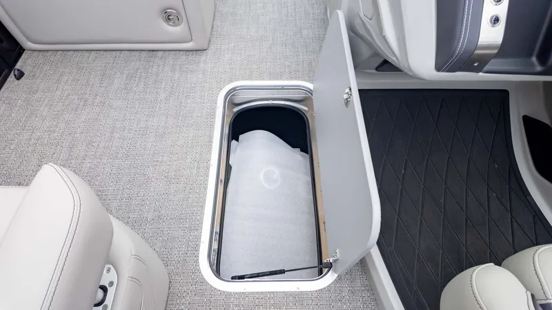 Slide: The Image of Open storage compartment in 2025 Barletta Lusso 23M boat interior. - 18