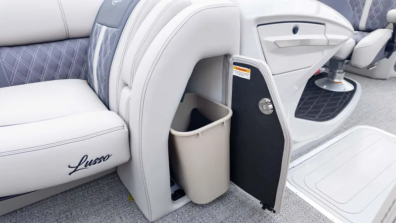 Slide: The Image of 2025 Barletta Lusso 23M boat interior with storage compartment and trash bin. - 24