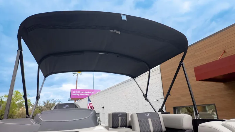 Slide: The Image of 2025 Barletta Lusso 23M boat with canopy, showcasing luxury seating and modern design. - 29