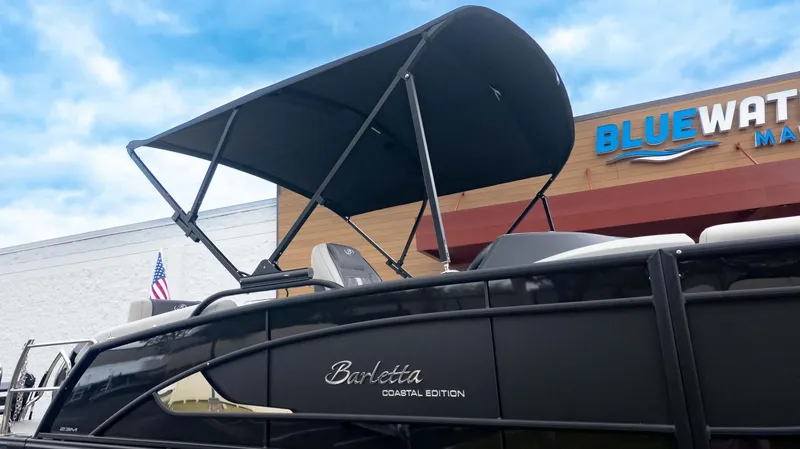 Slide: The Image of 2025 Barletta Lusso 23M boat with canopy at Bluewater Marina. - 30