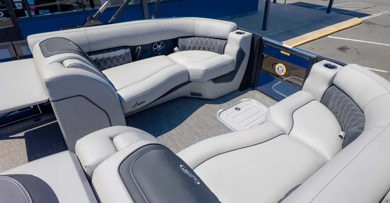 Slide: The Image of 2025 Barletta Lusso 25UE pontoon boat interior with luxurious seating and modern design. - 10