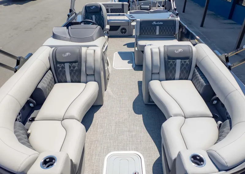 Slide: The Image of 2025 Barletta Lusso 25UE pontoon boat with luxurious seating and modern design. - 11