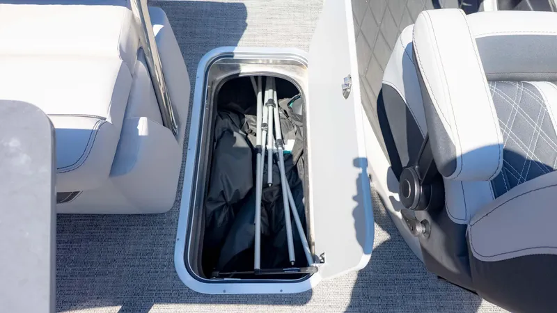 Slide: The Image of Storage compartment in 2025 Barletta Lusso 25UE boat, featuring sleek seating and organized interior. - 15
