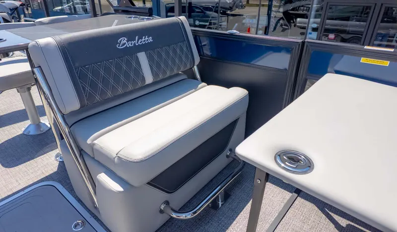 Slide: The Image of 2025 Barletta Lusso 25UE boat interior with luxurious seating and table. - 16