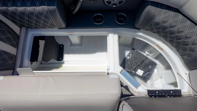 Slide: The Image of Interior storage compartment of 2025 Barletta Lusso 25UE boat with quilted seats. - 18