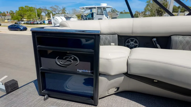 Slide: The Image of 2025 Barletta Lusso 25UE boat interior with luxurious seating and doggie dock view feature. - 20
