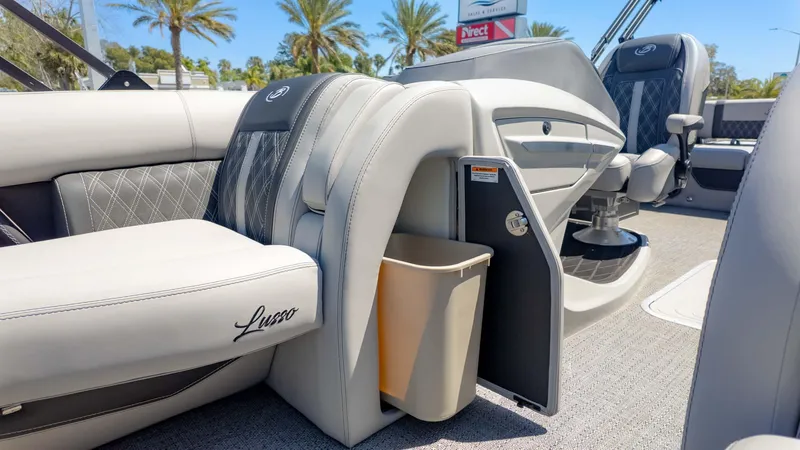 Slide: The Image of 2025 Barletta Lusso 25UE interior with luxurious seating and integrated storage. - 22