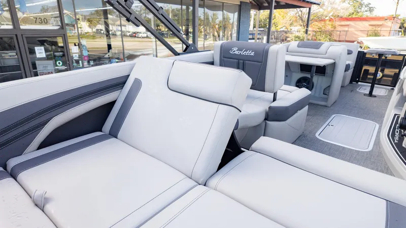 Slide: The Image of 2025 Barletta Corsa 23U boat interior with luxurious seating and modern design. - 12
