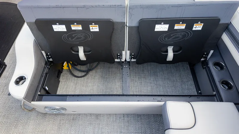 Slide: The Image of Interior seating of 2025 Barletta Corsa 23U boat with storage compartment. - 13