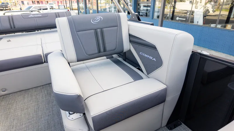 Slide: The Image of 2025 Barletta Corsa 23U boat interior with gray seating and logo detailing. - 15