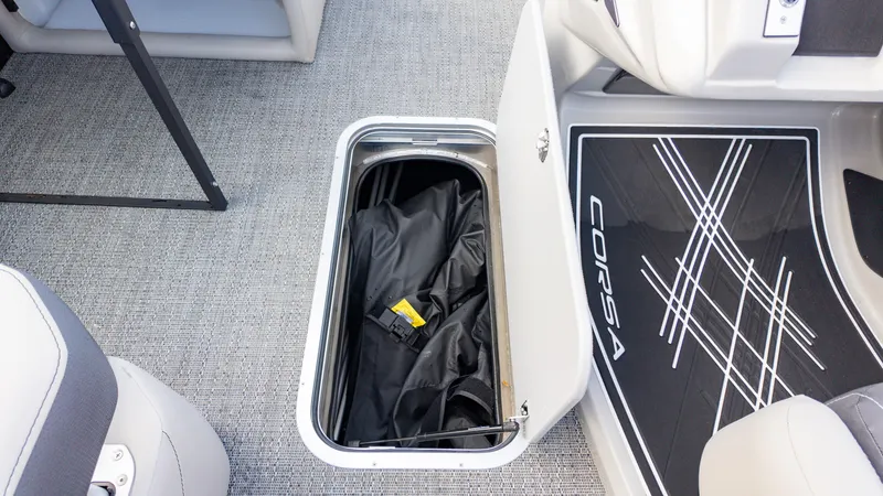 Slide: The Image of 2025 Barletta Corsa 23U boat storage compartment with open hatch and visible interior. - 16