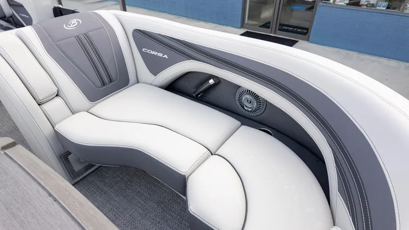 Slide: The Image of 2025 Barletta Corsa 23U boat interior with sleek gray and white seating design. - 17