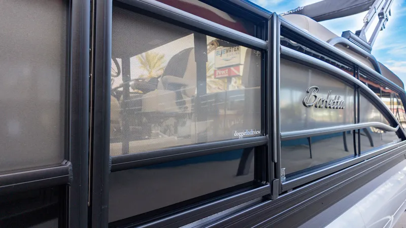 Slide: The Image of 2025 Barletta Corsa 23U boat with sleek design and doggie dock view feature. - 4