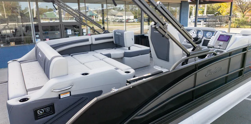 Slide: The Image of 2025 Barletta Corsa 23U pontoon boat interior with luxurious seating and modern dashboard. - 7