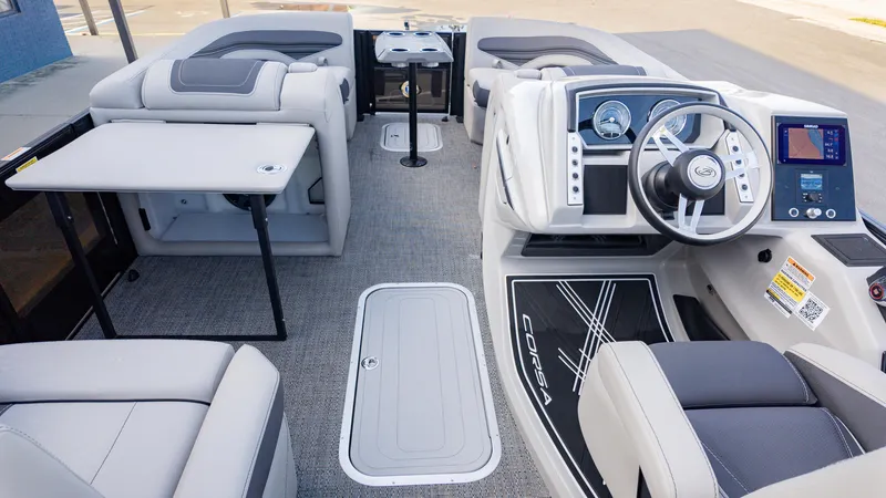 Slide: The Image of 2025 Barletta Corsa 23U boat interior with modern dashboard and seating. - 9