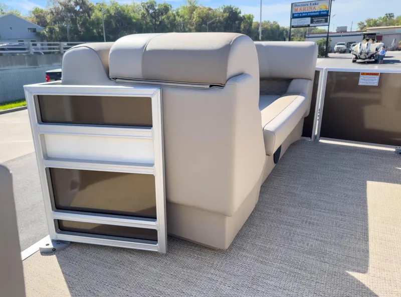 Slide: The Image of 2024 Bennington 188 SL pontoon boat with beige seating and modern design. - 16