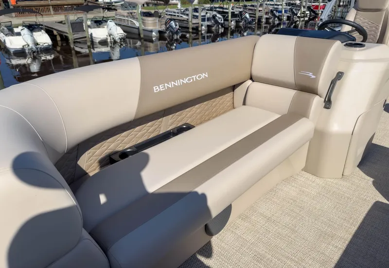 Slide: The Image of 2024 Bennington 188 SL boat interior with beige seating and elegant design. - 19