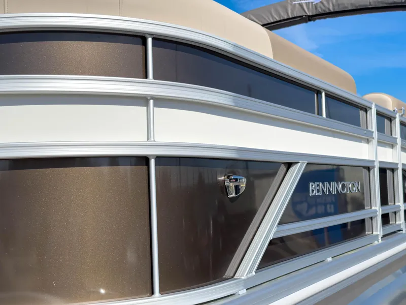 Slide: The Image of 2024 Bennington 188 SL pontoon boat with sleek metallic finish and elegant design. - 2