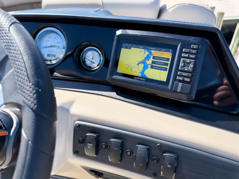Slide: The Image of Dashboard of 2024 Bennington 188 SL with Garmin navigation system and gauges. - 27