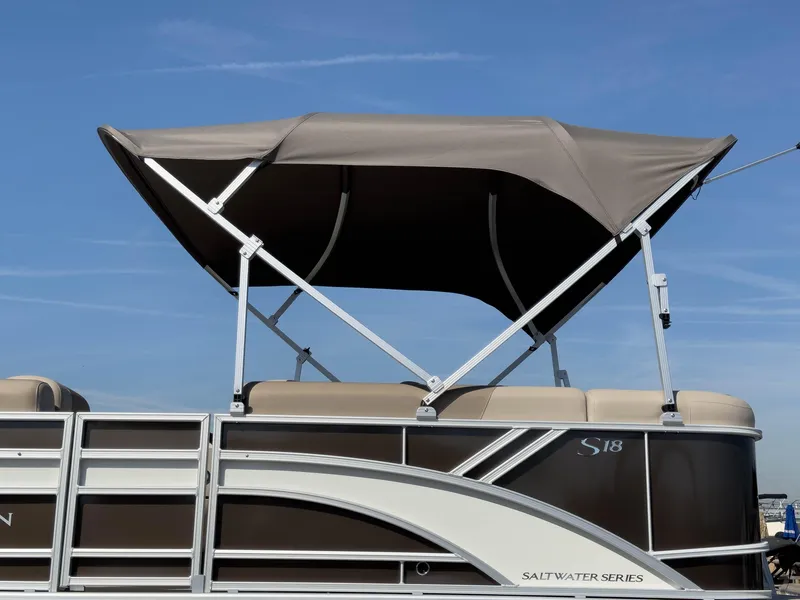Slide: The Image of 2024 Bennington 188 SL pontoon boat with canopy, Saltwater Series, side view. - 31