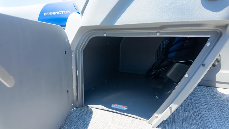 Slide: The Image of Open storage compartment on 2024 Bennington 20 SSR boat, showcasing interior space. - 26