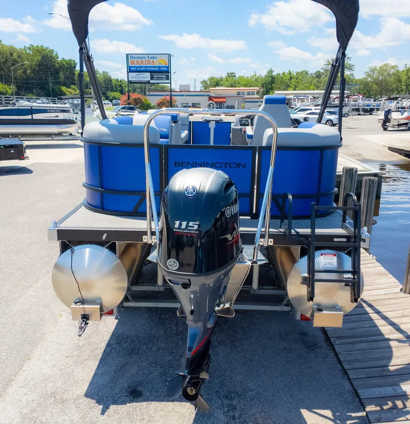 Slide: The Image of 2024 Bennington 20 SSR pontoon boat with Yamaha 115 engine at marina dock. - 5