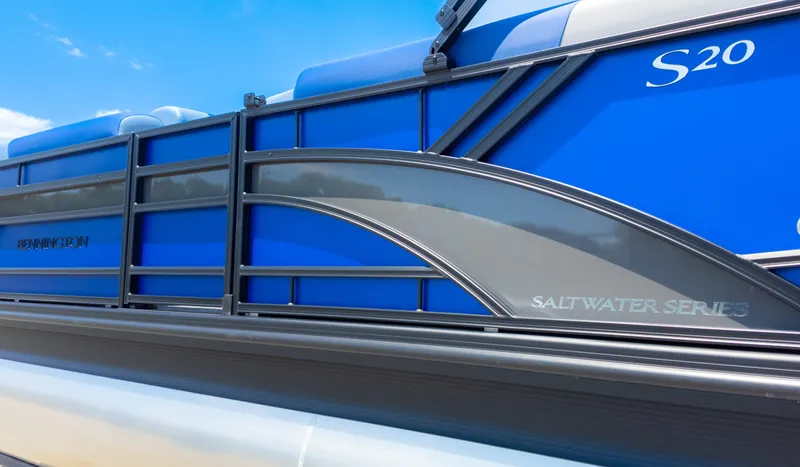 Slide: The Image of 2024 Bennington 20 SSR Saltwater Series pontoon boat with blue and gray design. - 6