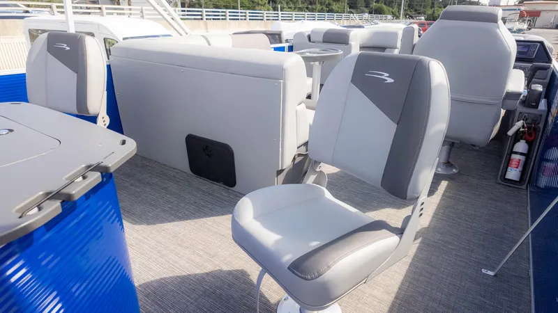 Slide: The Image of 2025 Bennington 20 SVS Stern Fish boat interior with gray seating and blue accents. - 14