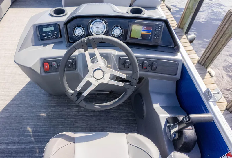 Slide: The Image of 2025 Bennington 20 SVS Stern Fish boat dashboard with steering wheel and control panel. - 22