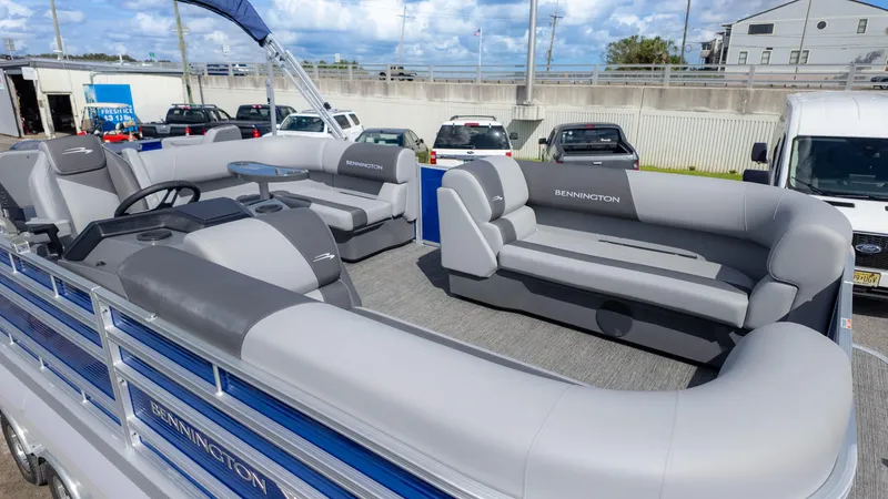 Slide: The Image of 2025 Bennington 20 SVS Stern Fish pontoon boat with spacious seating and modern design. - 6