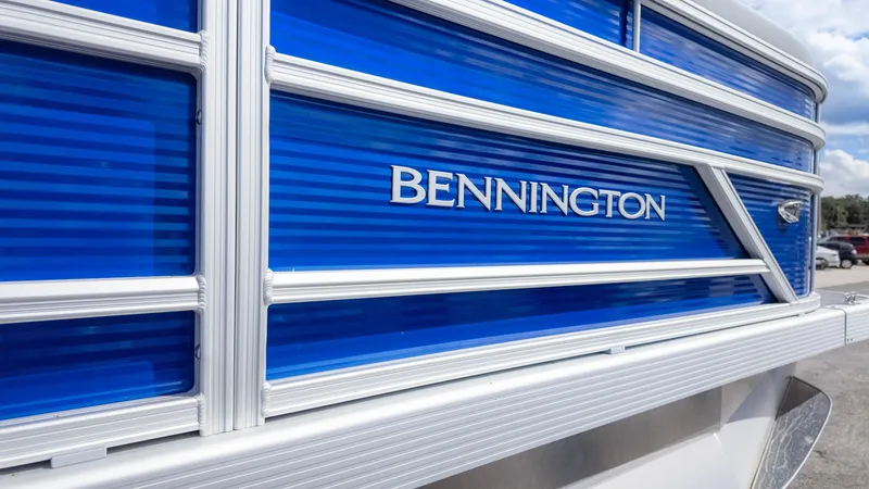 Slide: The Image of 2025 Bennington 20 SVS Stern Fish boat with blue and white exterior detailing. - 7