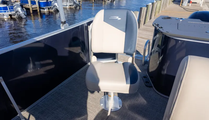 Slide: The Image of 2025 Bennington 21 SF boat seat on deck by waterfront dock. - 12