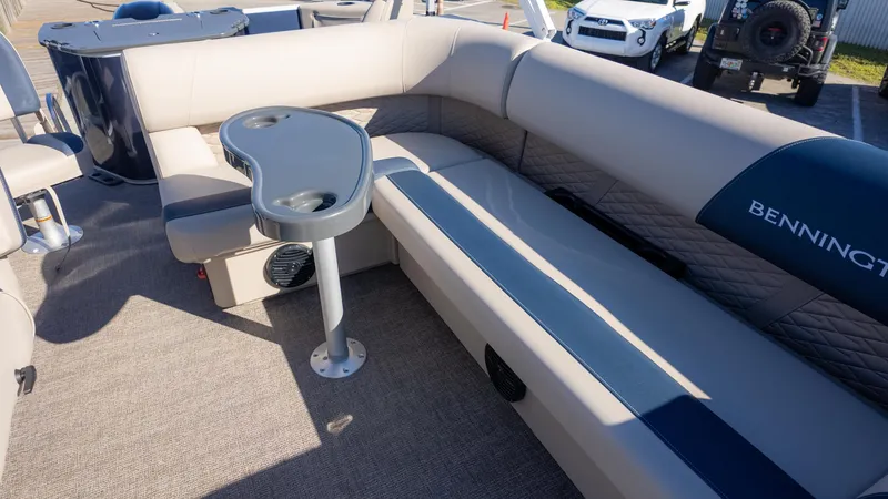Slide: The Image of 2025 Bennington 21 SF pontoon boat interior with seating and table. - 16