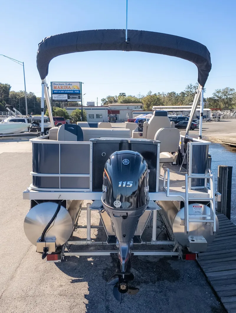 Slide: The Image of 2025 Bennington 21 SF pontoon boat with Yamaha 115 outboard motor at marina. - 6