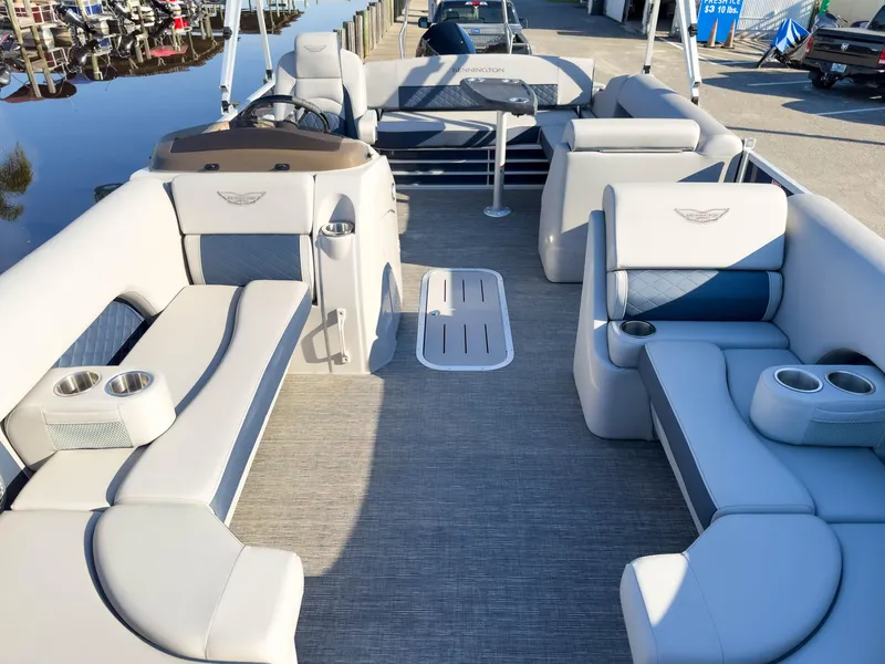 Slide: The Image of 2024 Bennington 22 LSB pontoon boat interior with luxurious seating and cup holders. - 12