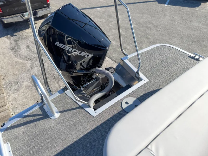 Slide: The Image of 2024 Bennington 22 LSB boat with Mercury engine, rear view on dock. - 14