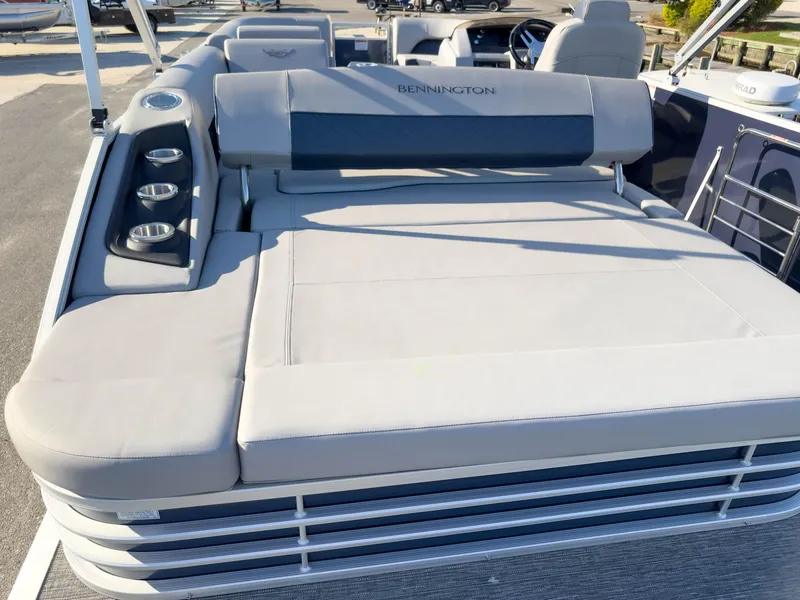 Slide: The Image of 2024 Bennington 22 LSB pontoon boat with spacious seating and cup holders. - 15