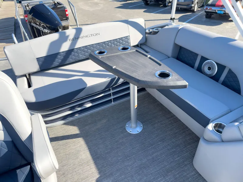 Slide: The Image of 2024 Bennington 22 LSB pontoon boat interior with seating and table. - 20