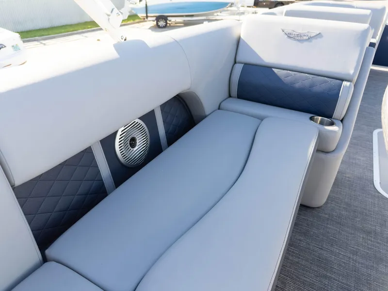 Slide: The Image of 2024 Bennington 22 LSB boat interior with luxurious seating and integrated speaker system. - 21