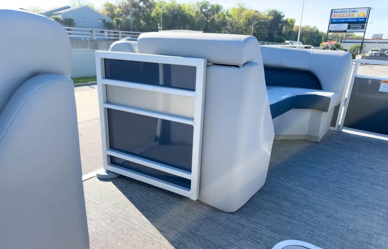 Slide: The Image of 2024 Bennington 22 LSB pontoon boat interior with seating and storage. - 24