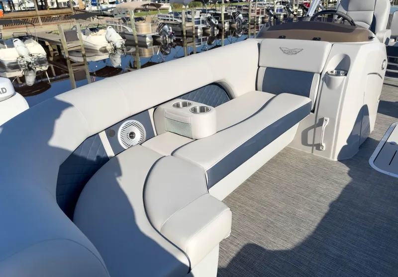 Slide: The Image of 2024 Bennington 22 LSB boat interior with plush seating and cup holders. - 28