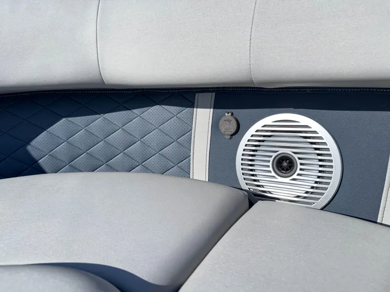 Slide: The Image of 2024 Bennington 22 LSB boat interior with cushioned seating and built-in speaker. - 31